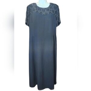 Talbot Black dress with stones on all the sleeves and shoulders in the shape of